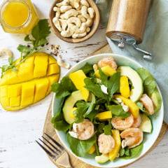Abundant Catering Salad with arugula, mango, avocado, shrimp, pecans